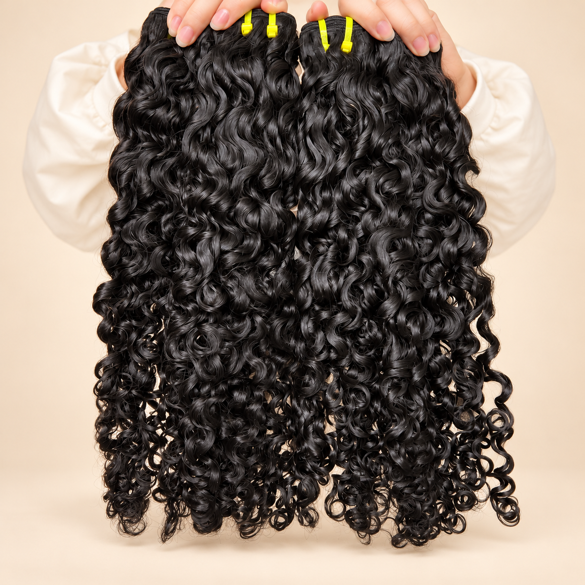 The Allure Premium Virgin Burmese Curly bundles on warm cream background