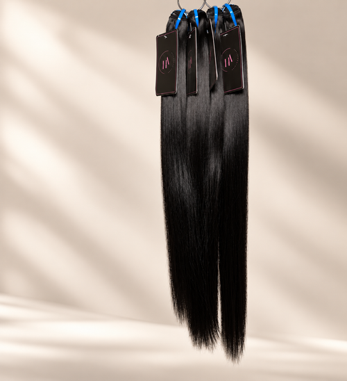 Hair Addiction Signature Raw Straight bundles with reduced flyaways on warm cream background