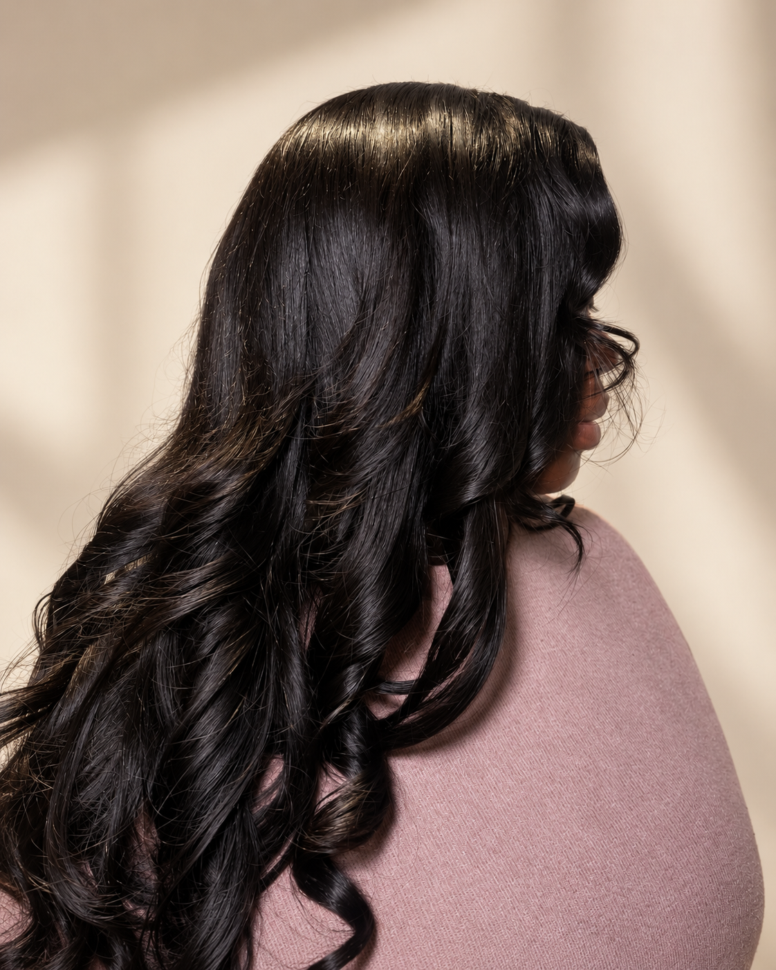 The Muse Premium Virgin Body Wave styled install on warm cream background